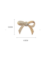 APLIQUE PLASTICO MOÑO STRASS